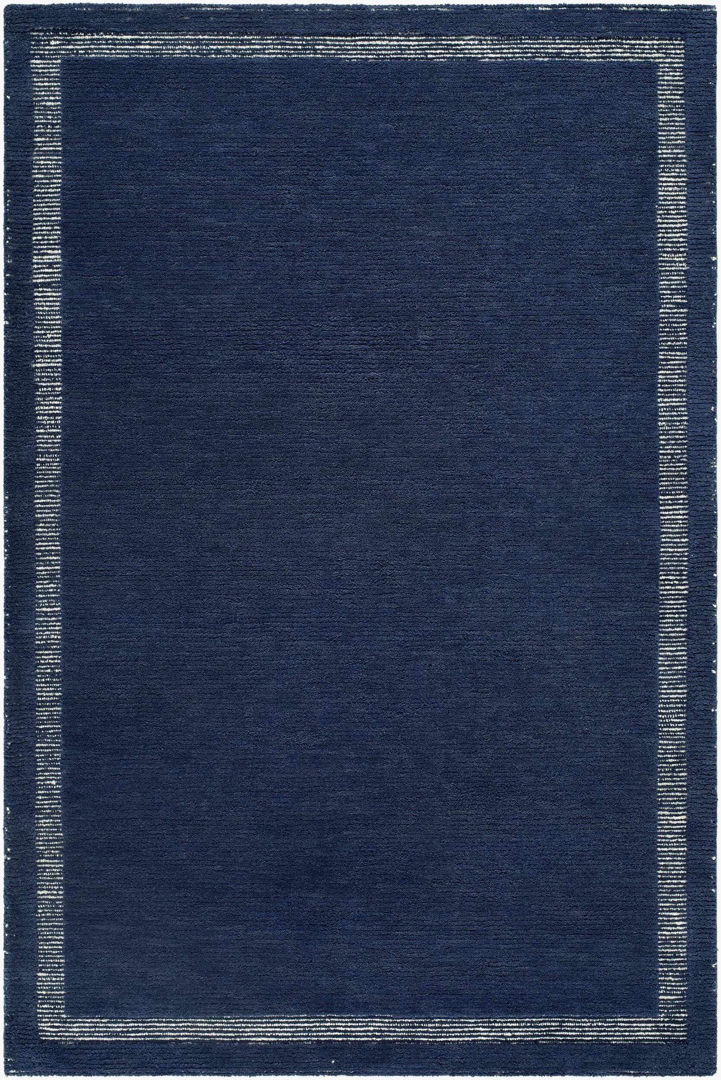 Close-up of the Tufape Modern Minimalist Handmade Area Rug; rectangle shape, slate gray wool with thin purple border. Design-Rectangle-576